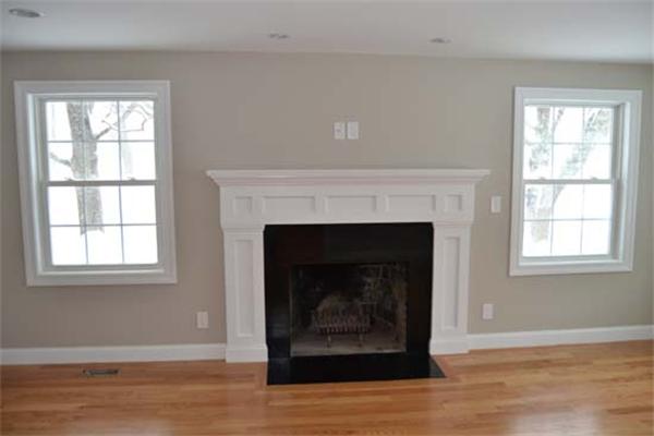 1 Henderson Avenue Andover, MA 01810 - Photo 9 of 26 a living room with a fireplace and a fireplace
