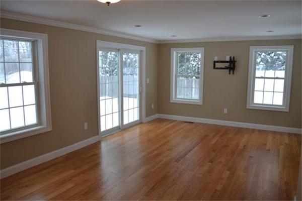 1 Henderson Avenue Andover, MA 01810 - Photo 10 of 26 a view of an empty room with wooden floor and windows