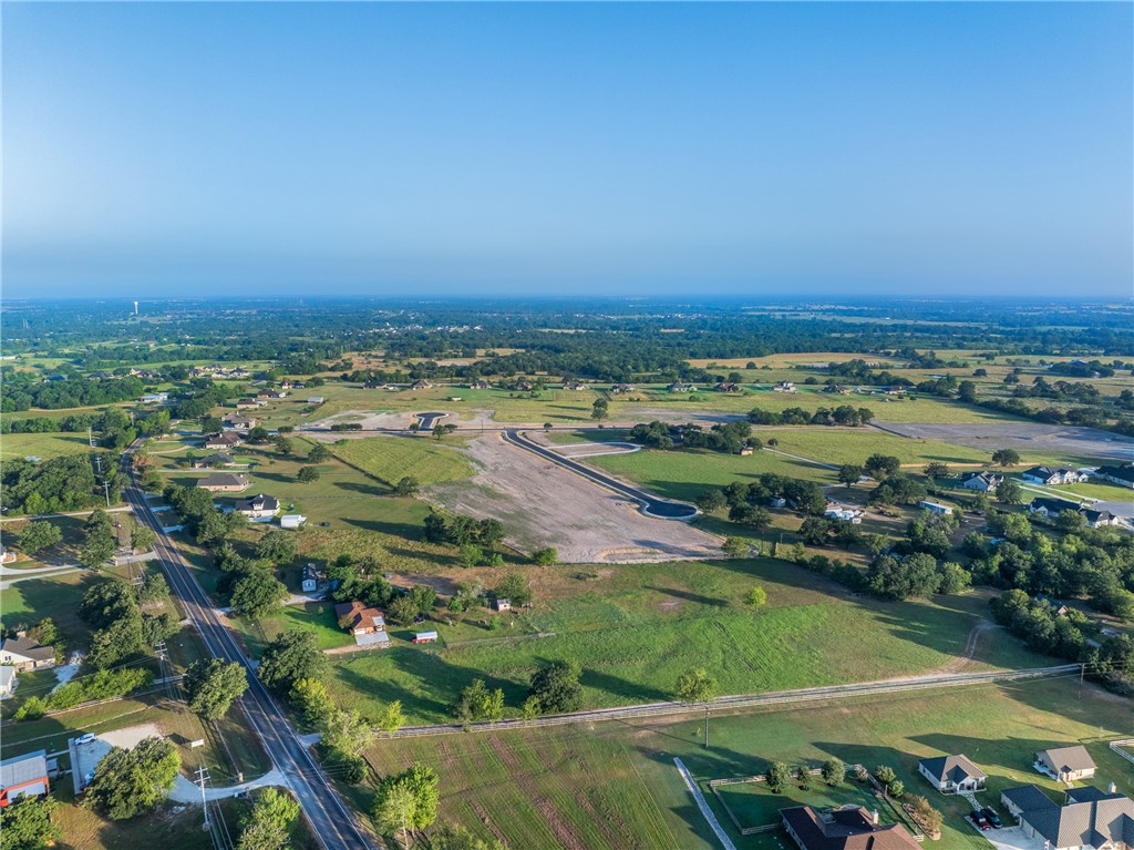 6945 Ellehue Lane Bryan, TX 77808 - Photo 6 of 6 an aerial view of a residential houses with outdoor space and trees
