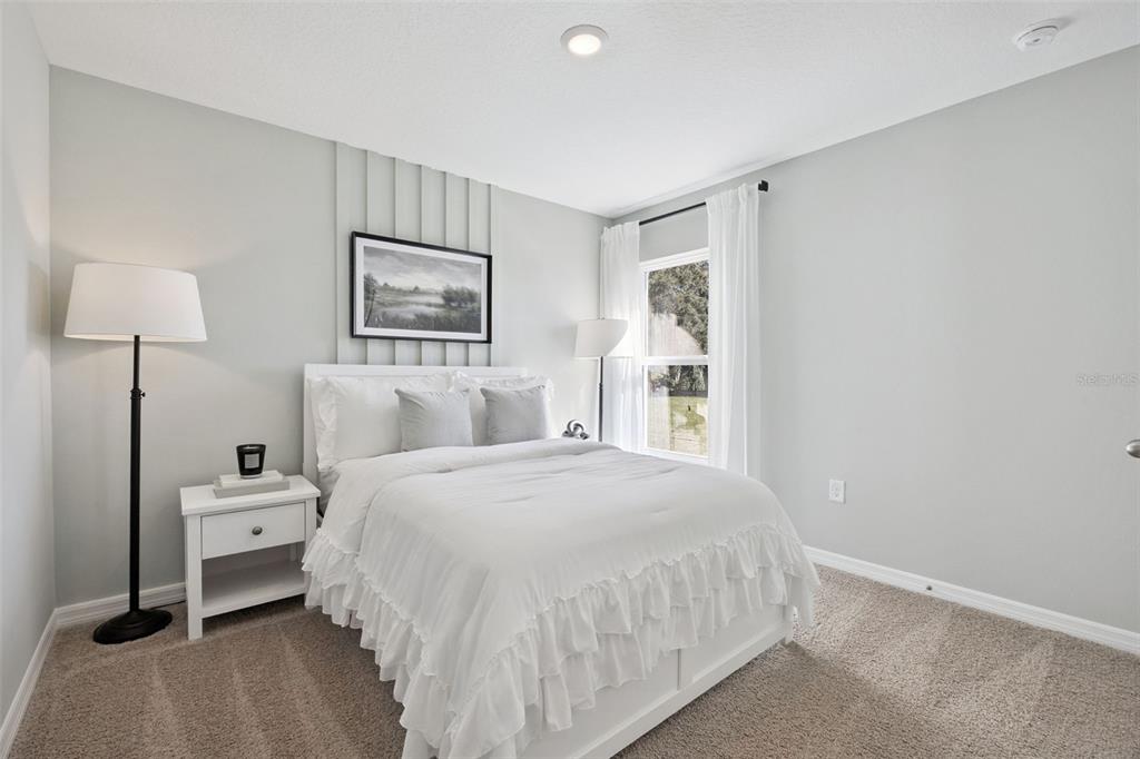 3419 Nettle Loop Tavares, FL 32778 - Photo 21 of 29 a bedroom with a bed and a window