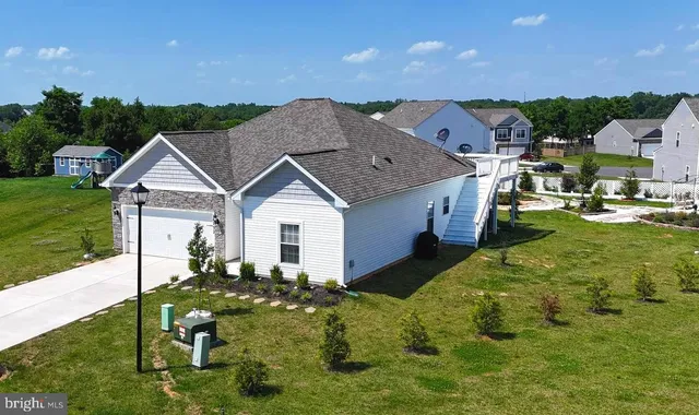 a aerial view of a house with table and chairs in patio