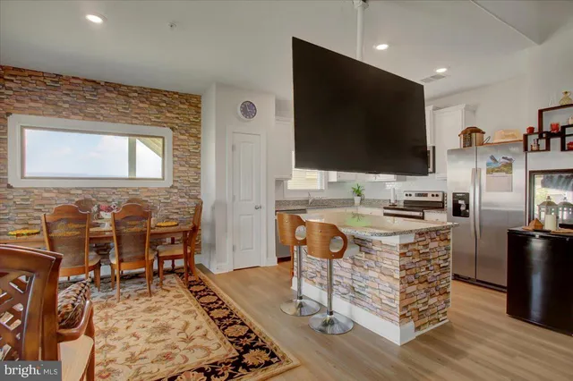 a view of a livingroom with furniture and window