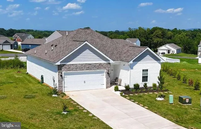 a view of house with garden space and street view