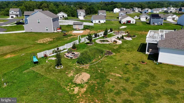 an aerial view of a house with swimming pool yard and outdoor seating