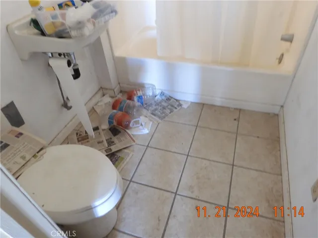 a kitchen with granite countertop a stove and a wooden floor