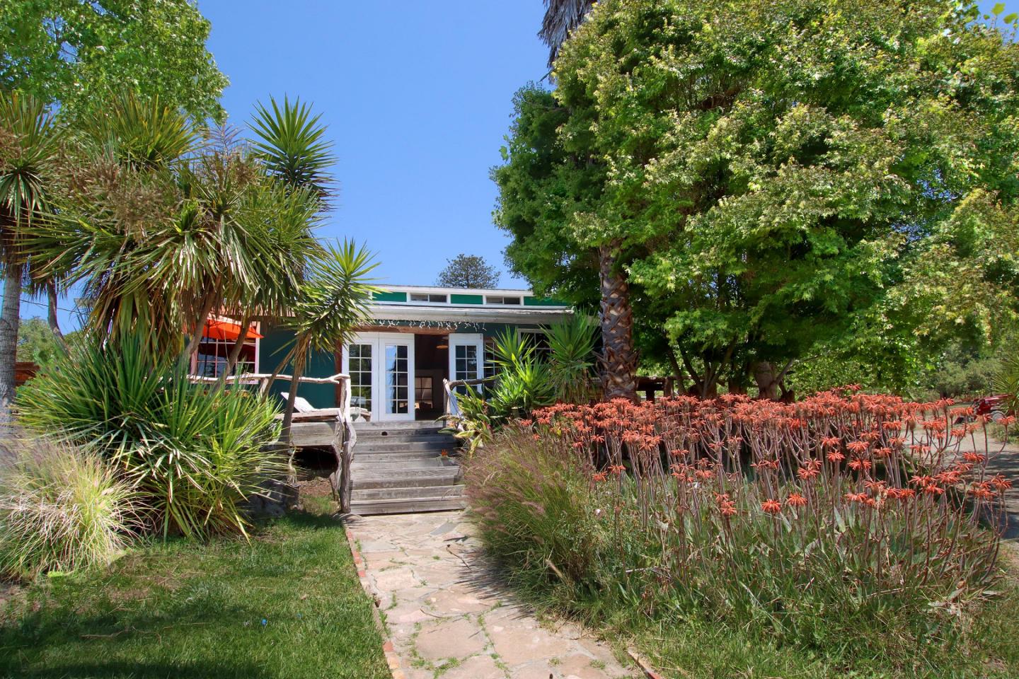 a view of a backyard with patio