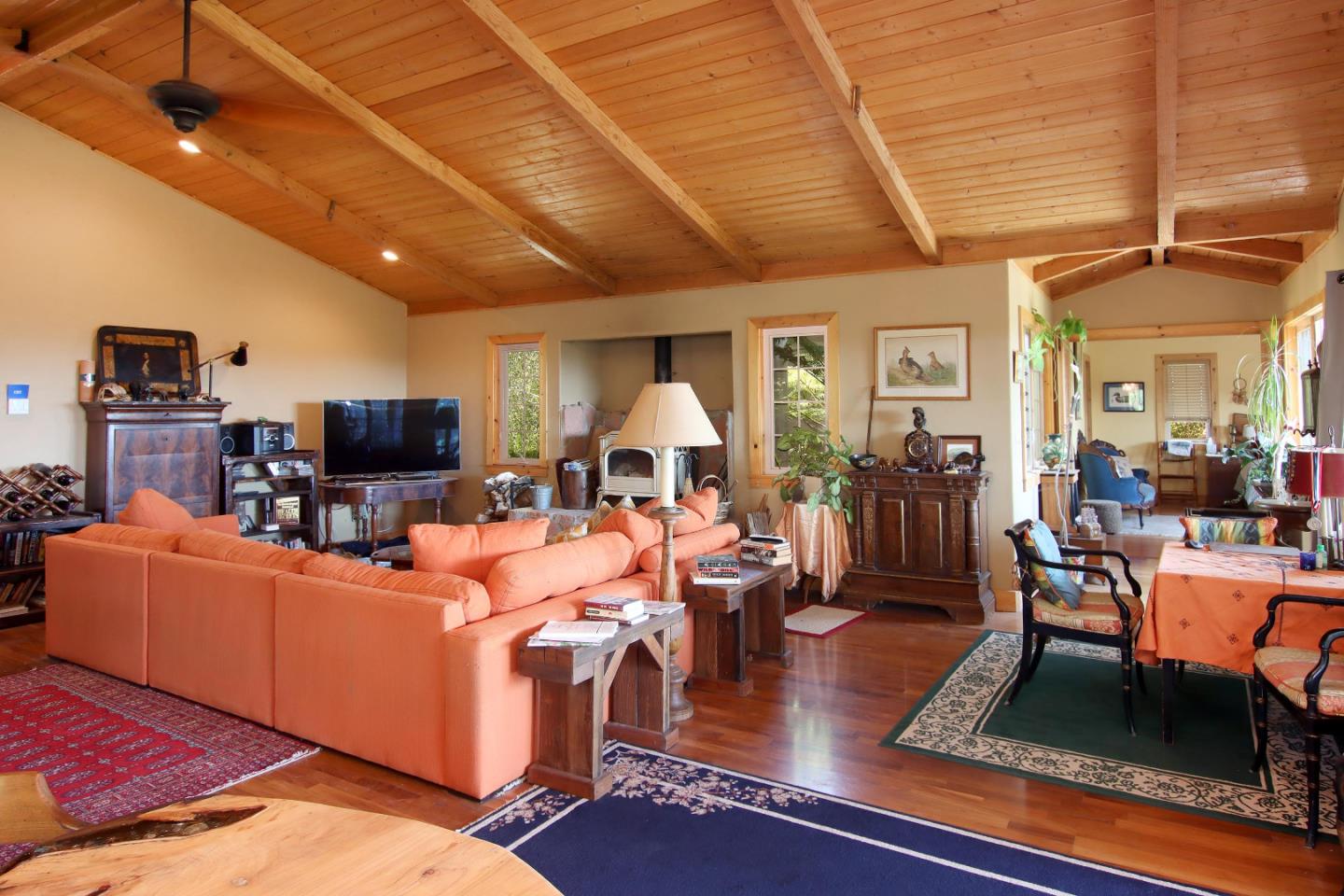 434 Old Smith Road Watsonville, CA 95076 - Photo 14 of 61 a living room with furniture a fireplace and a flat screen tv