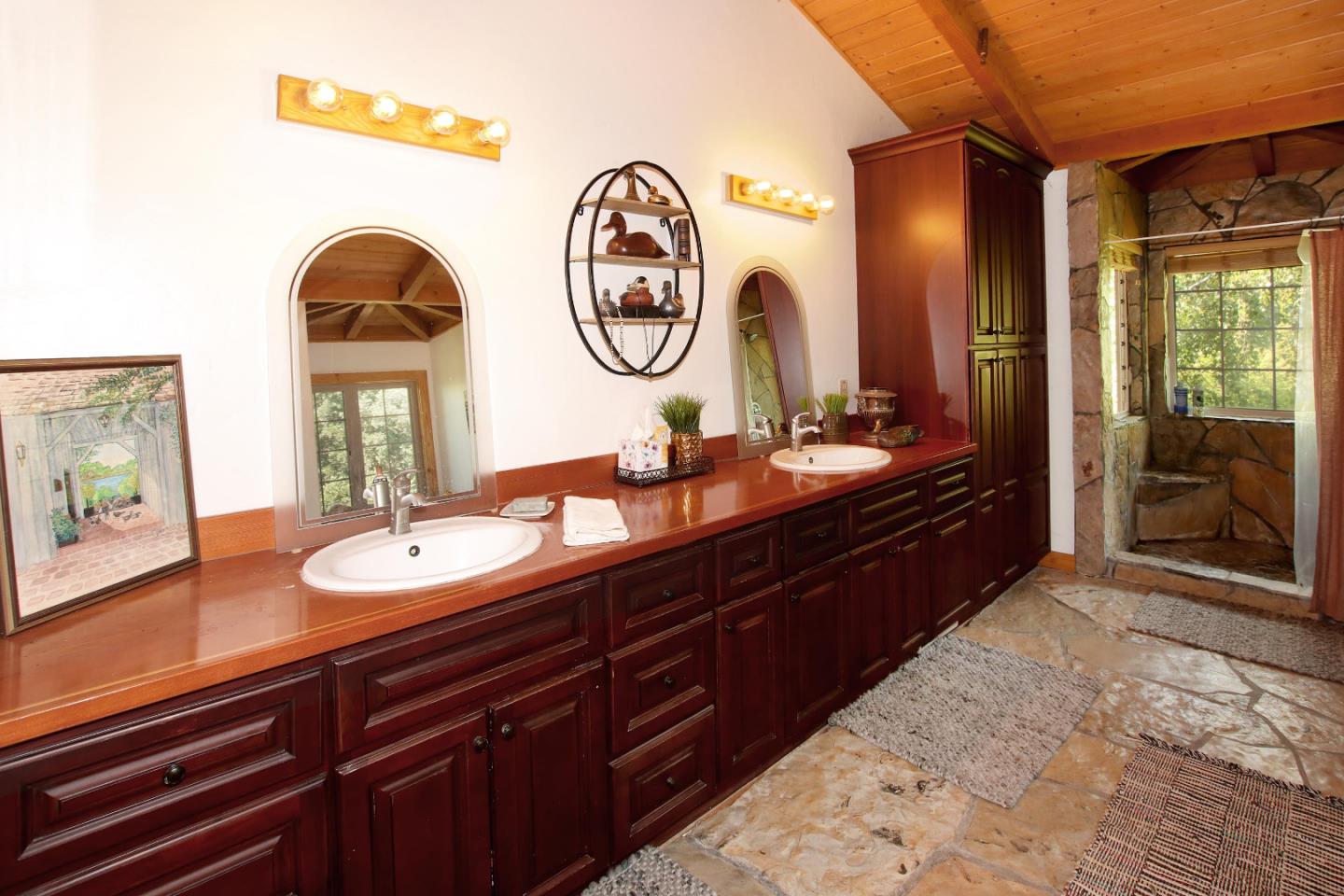434 Old Smith Road Watsonville, CA 95076 - Photo 20 of 61 a bathroom with a double vanity sink and a mirror