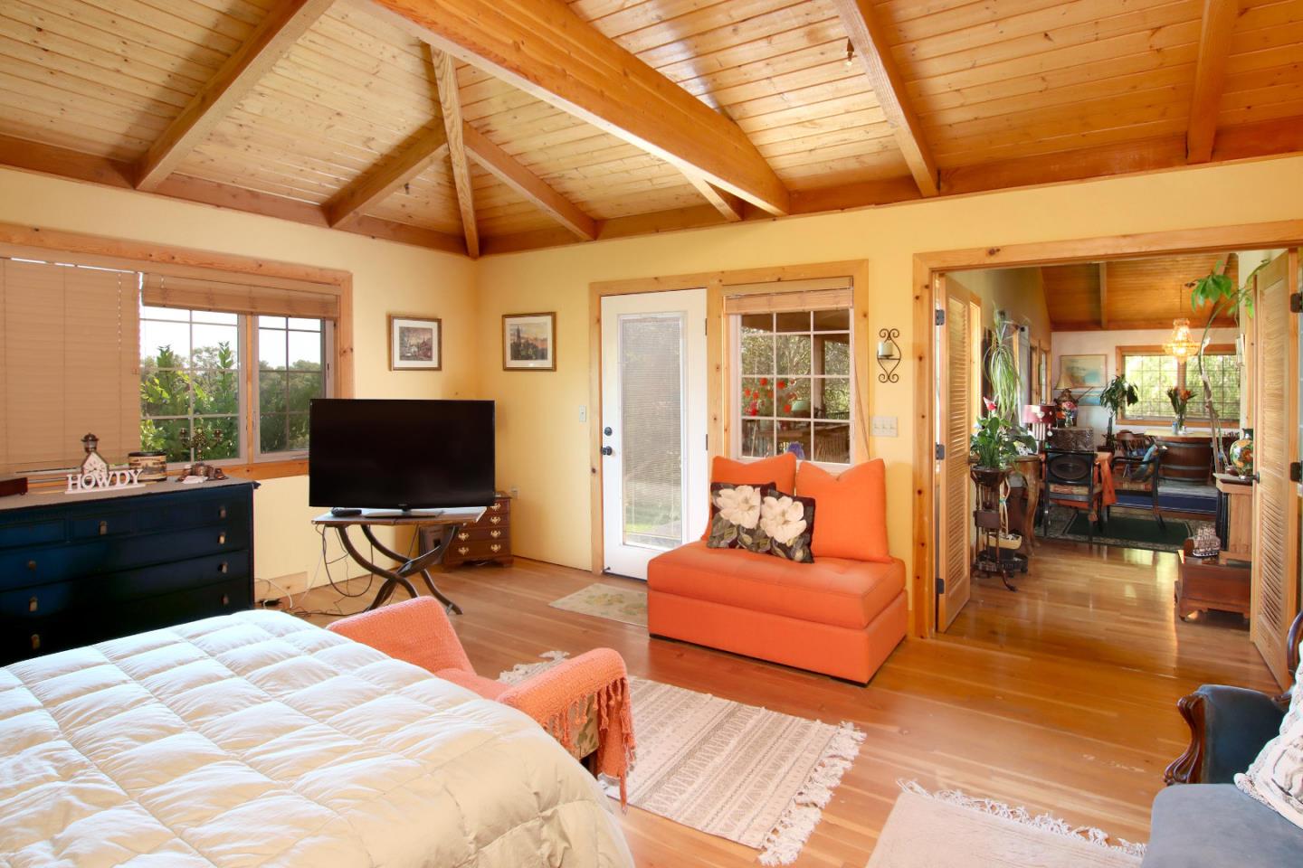 434 Old Smith Road Watsonville, CA 95076 - Photo 25 of 61 a bedroom with furniture a flat screen tv and a bathtub