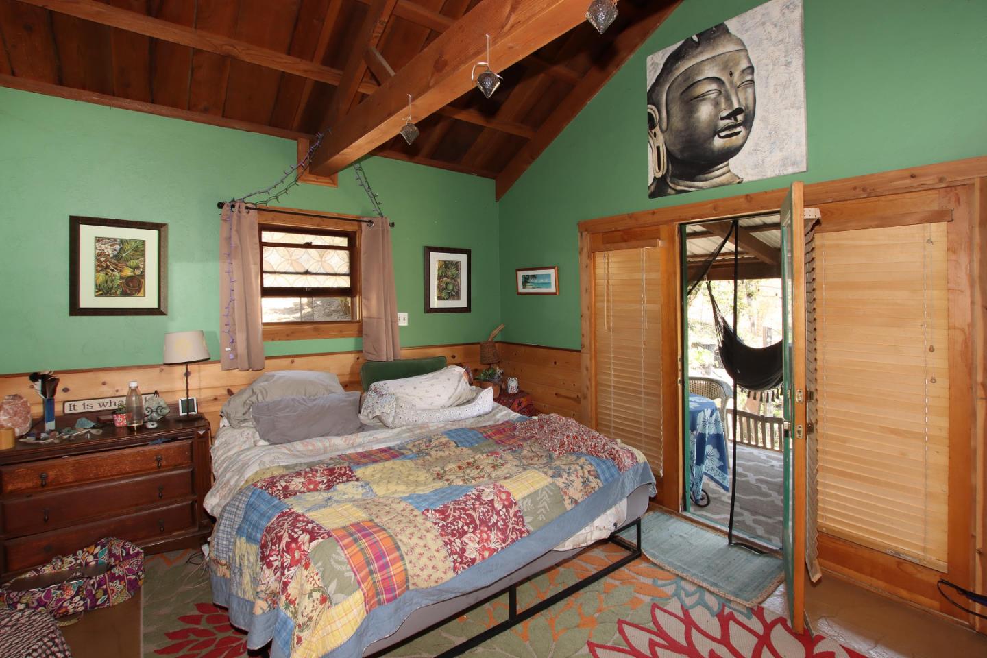 434 Old Smith Road Watsonville, CA 95076 - Photo 39 of 61 a bedroom with a bed a mirror and dresser