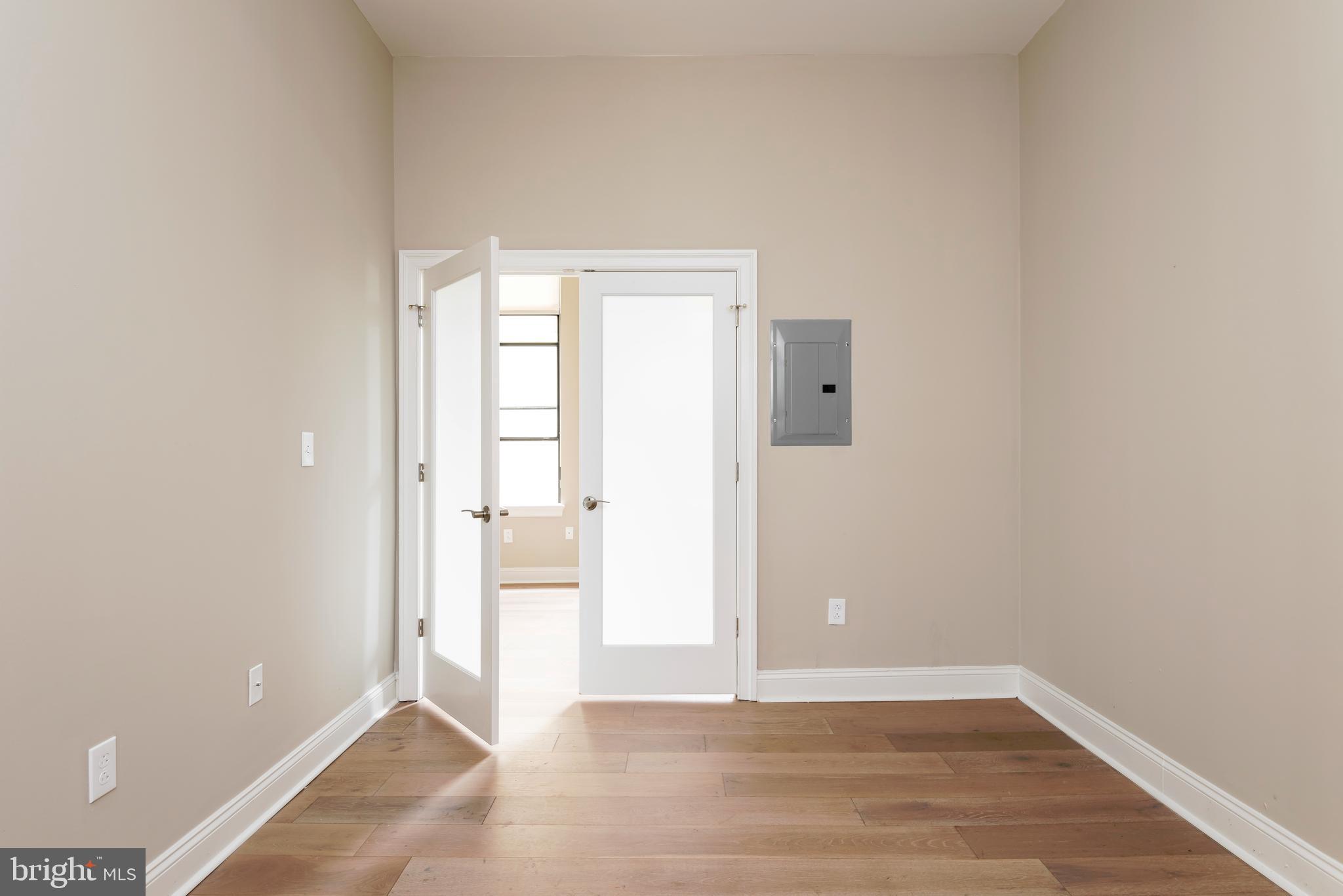 33 Letitia Street, Unit 306 Philadelphia, PA 19106 - Photo 19 of 24 a view of an empty room with wooden floor and a window