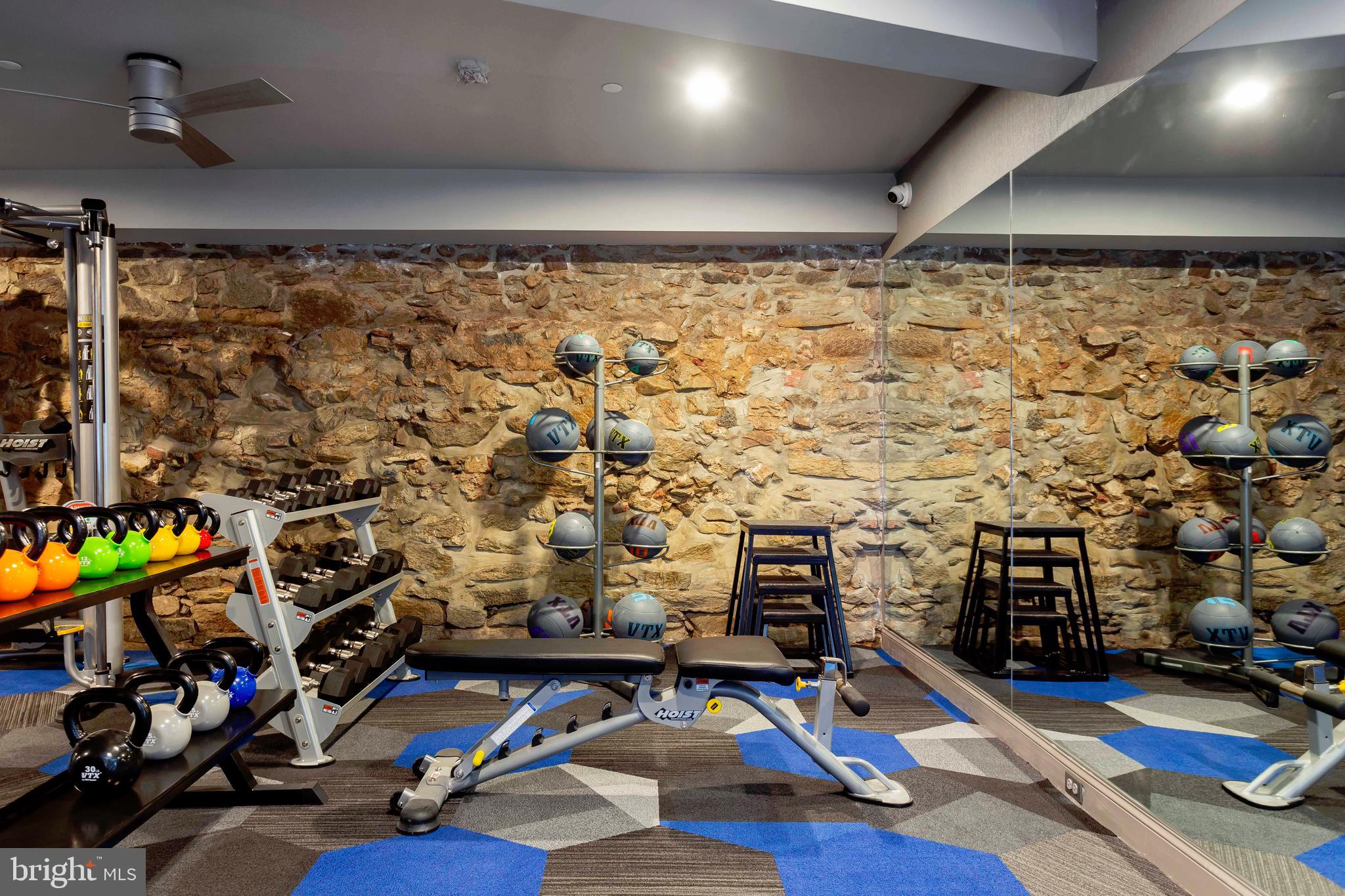 33 Letitia Street, Unit 306 Philadelphia, PA 19106 - Photo 5 of 24 a room with gym equipment and a flat screen tv
