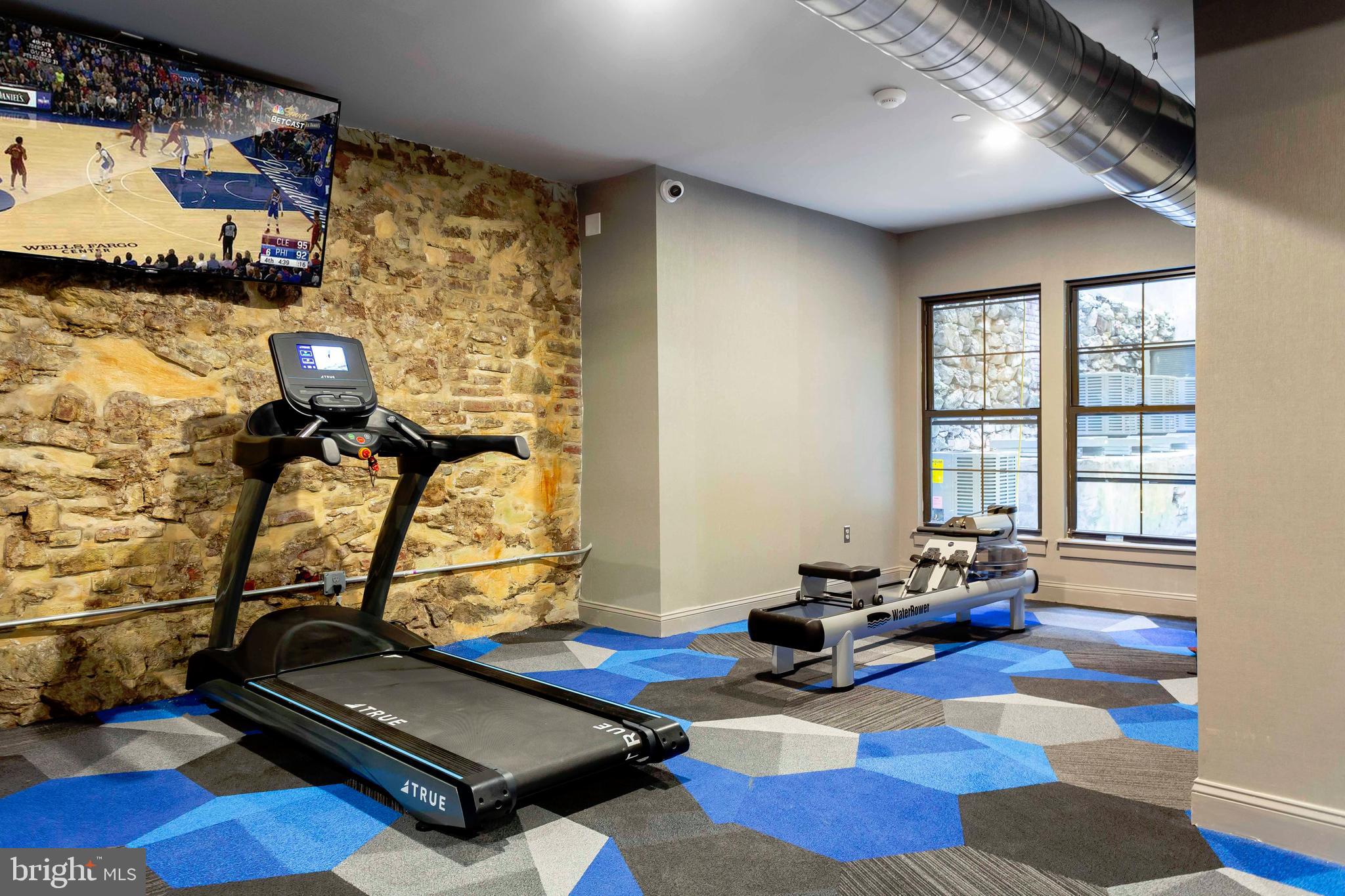 33 Letitia Street, Unit 306 Philadelphia, PA 19106 - Photo 10 of 24 a room with gym equipment and a rug
