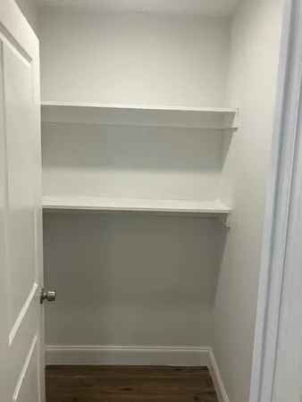 a view of small space with racks on the wall