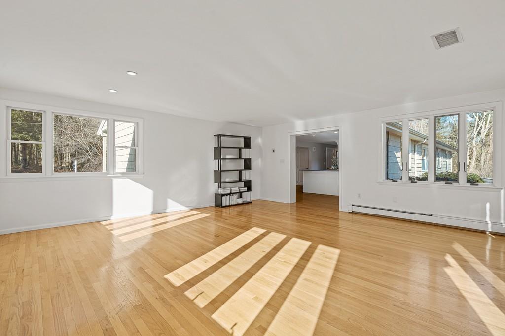 23 Williams Road Concord, MA 01742 - Photo 11 of 32 a view of a bedroom with wooden floor and windows