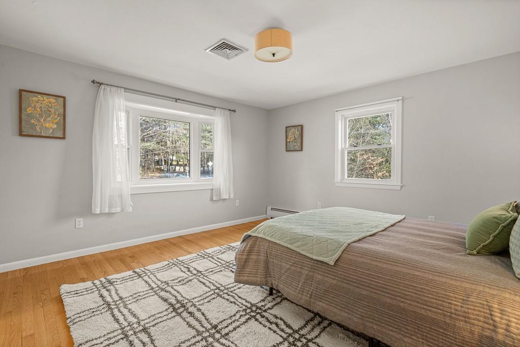 23 Williams Road Concord, MA 01742 - Photo 12 of 32 a bedroom with a bed and a window