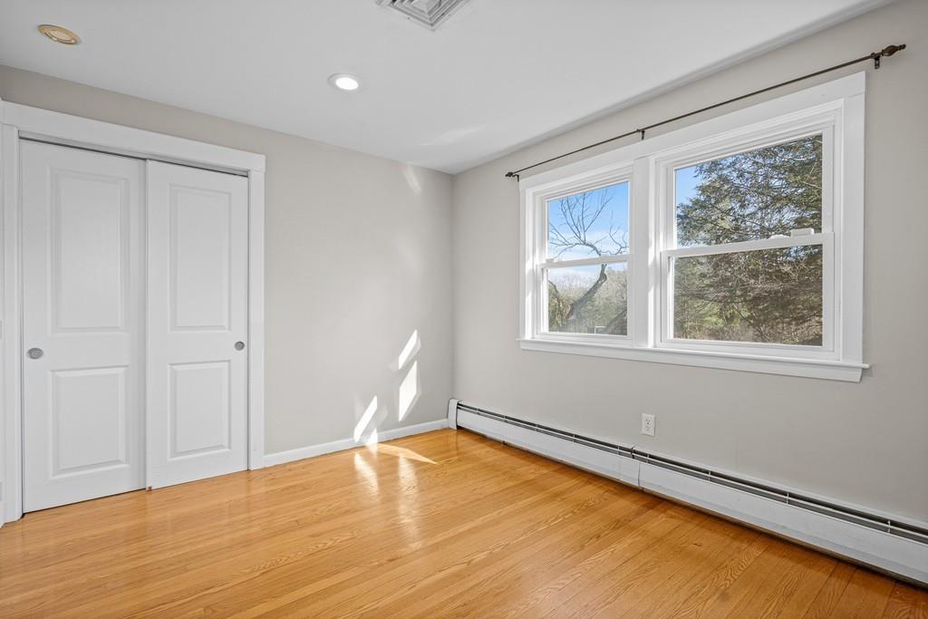 23 Williams Road Concord, MA 01742 - Photo 18 of 32 a view of empty room with wooden floor and fan
