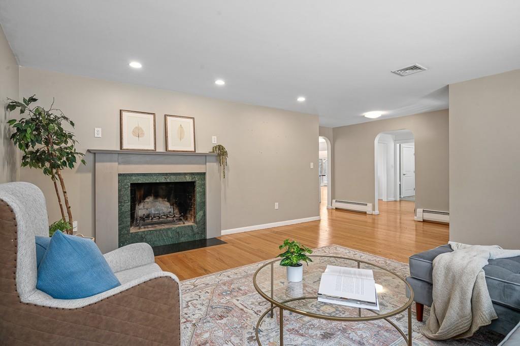 23 Williams Road Concord, MA 01742 - Photo 2 of 32 a living room with furniture and a fireplace