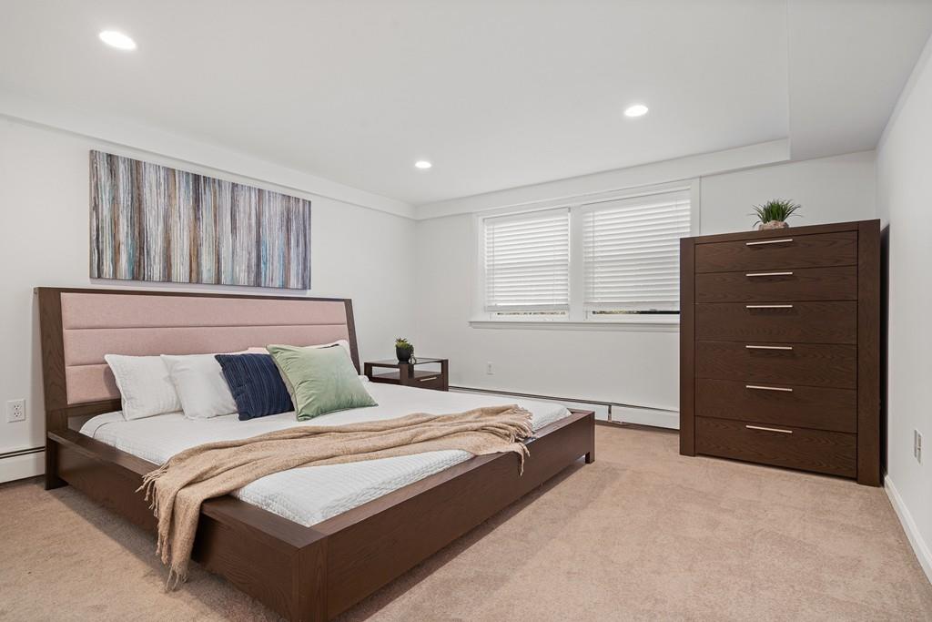 23 Williams Road Concord, MA 01742 - Photo 25 of 32 a bedroom with a bed and window