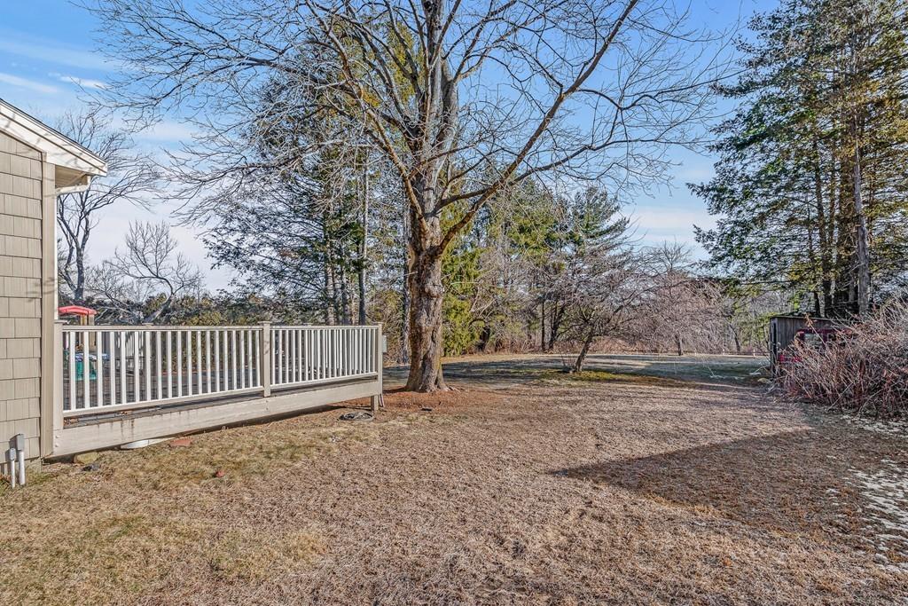 23 Williams Road Concord, MA 01742 - Photo 27 of 32 a backyard of a house with lots of green space