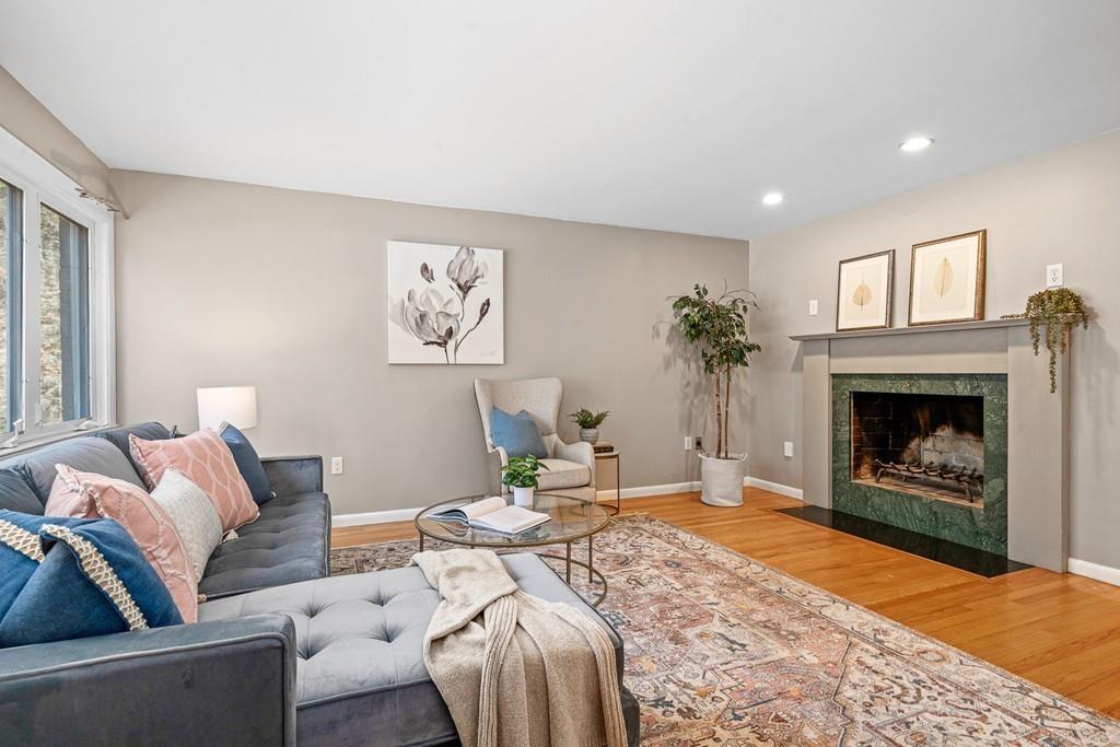 23 Williams Road Concord, MA 01742 - Photo 3 of 32 a living room with furniture and a fireplace