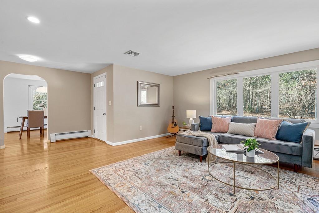 23 Williams Road Concord, MA 01742 - Photo 4 of 32 a living room with furniture and a large window