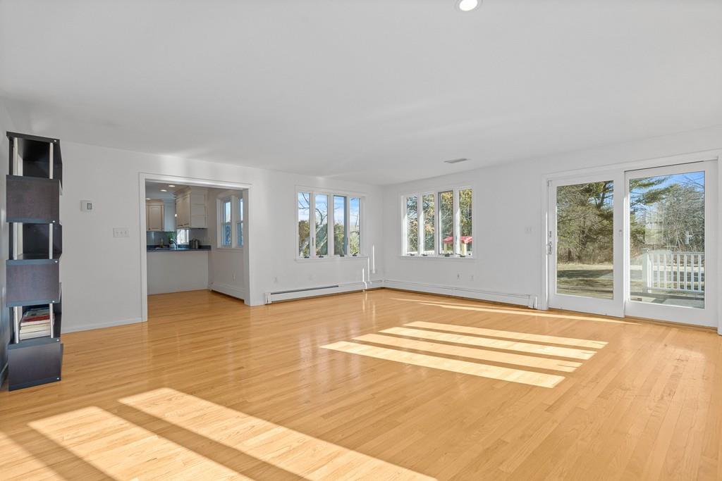 23 Williams Road Concord, MA 01742 - Photo 10 of 32 a view of a livingroom with wooden floor and a flat screen tv