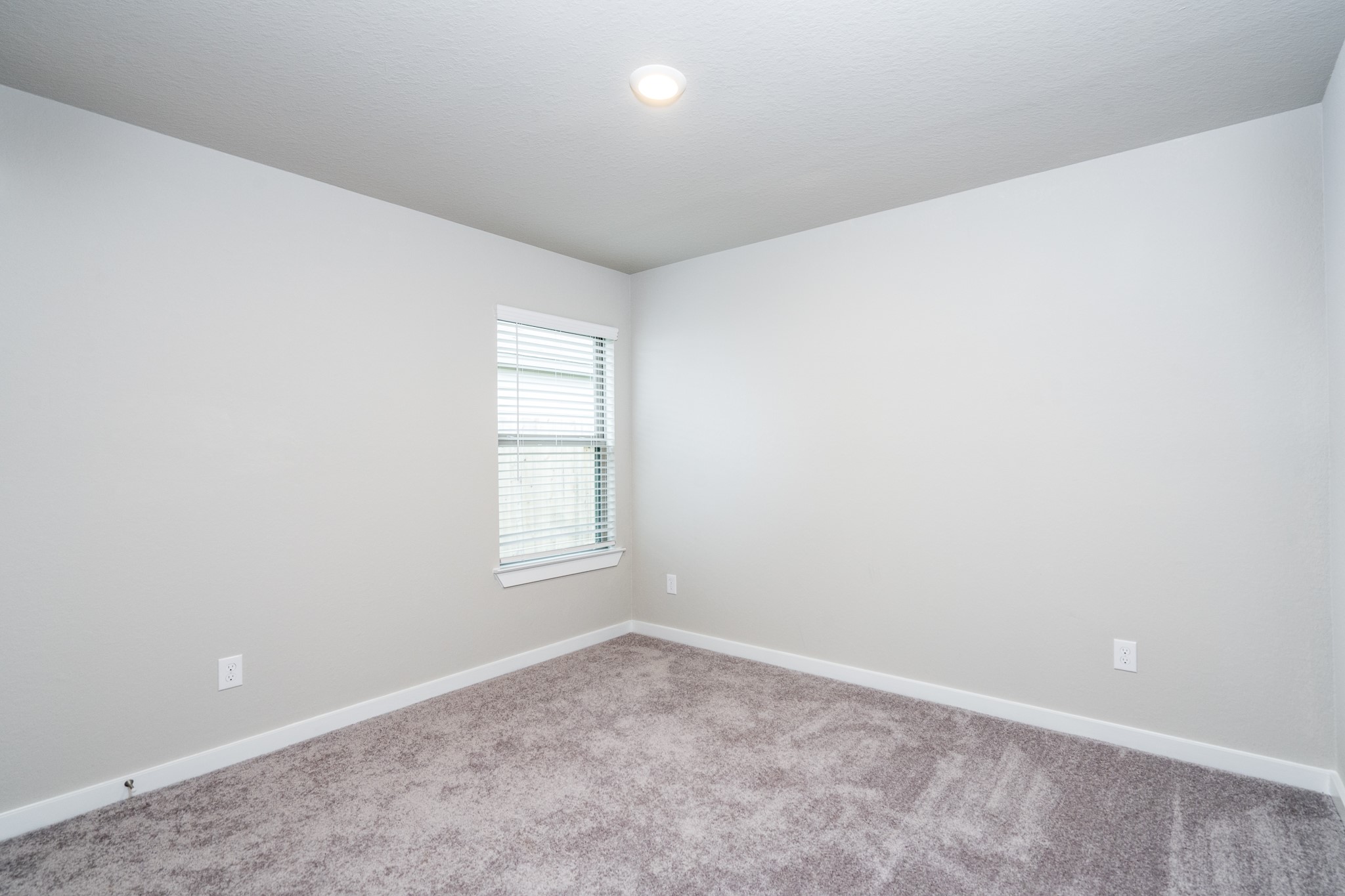 17536 Rosewood Manor Lane New Caney, TX 77357 - Photo 16 of 27 an empty room with a window