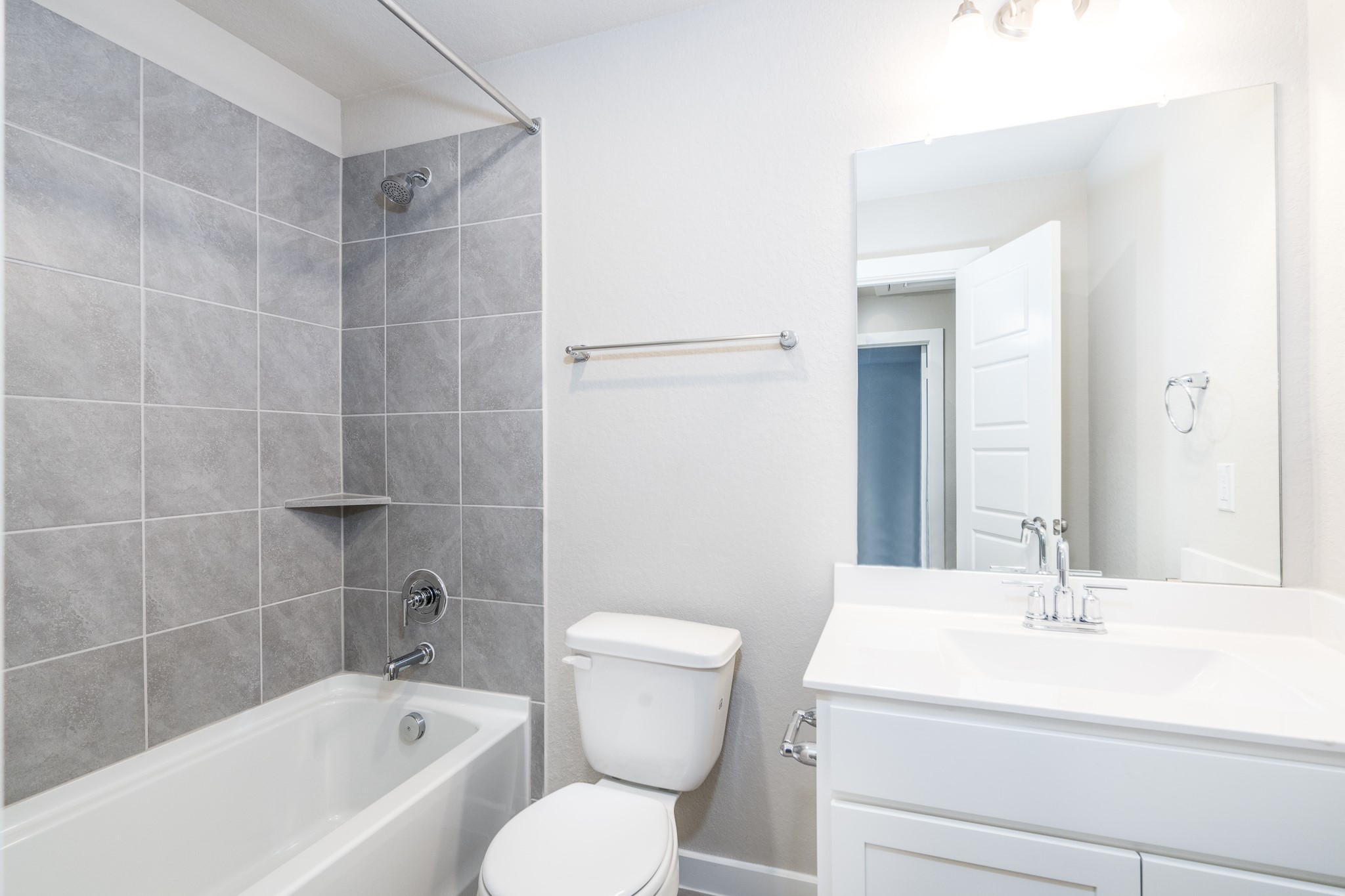 17536 Rosewood Manor Lane New Caney, TX 77357 - Photo 17 of 27 a bathroom with a sink a toilet and shower