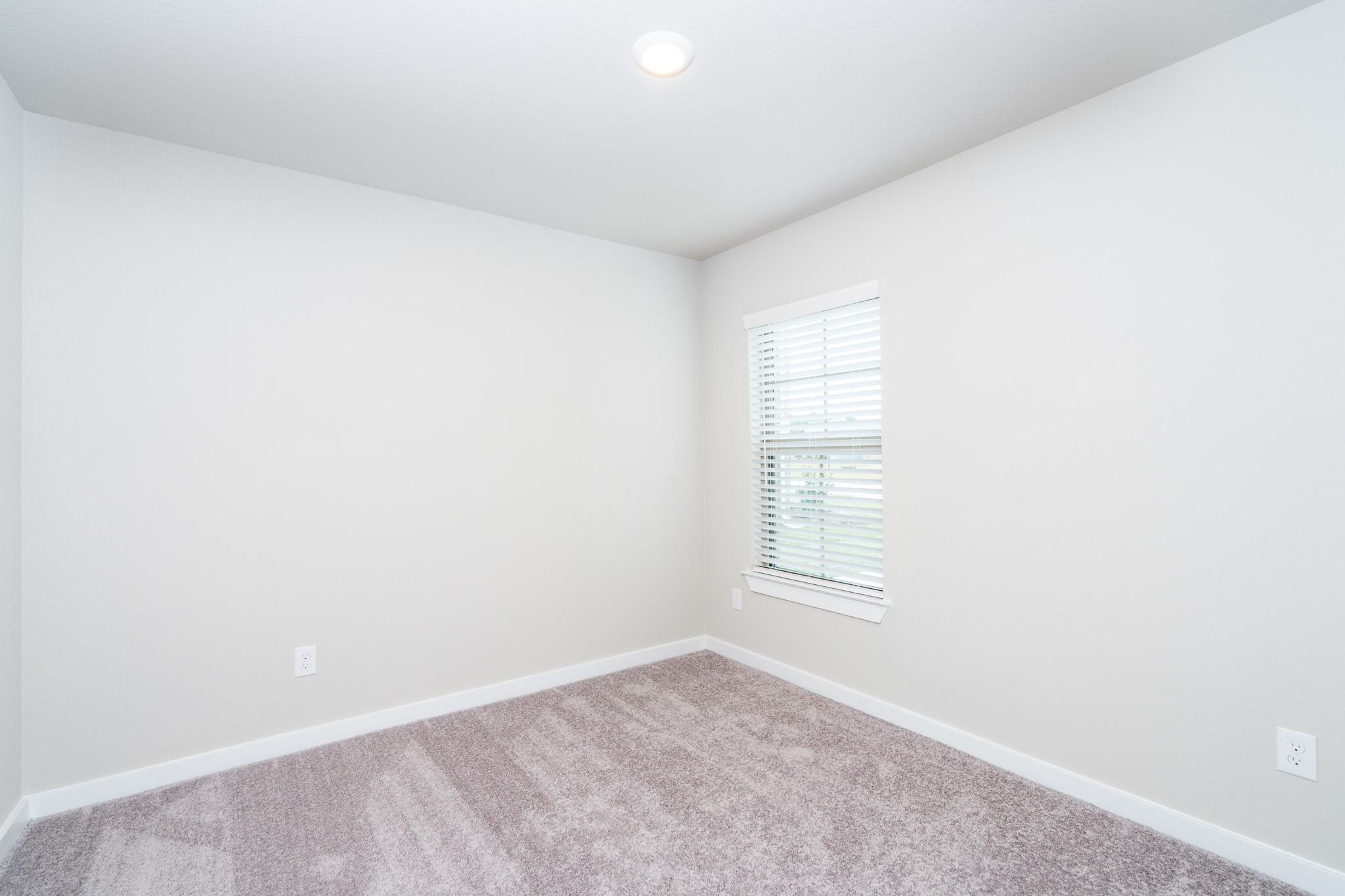 17536 Rosewood Manor Lane New Caney, TX 77357 - Photo 18 of 27 an empty room with windows