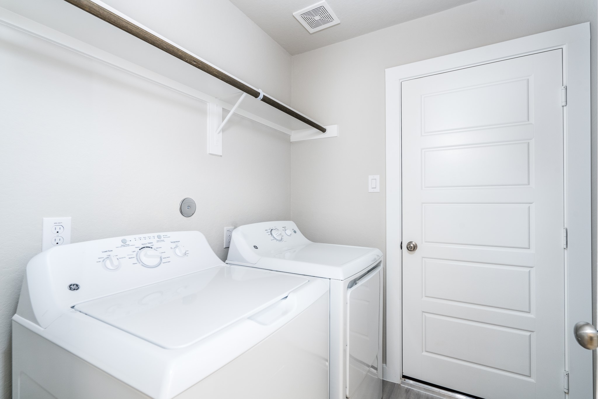 17536 Rosewood Manor Lane New Caney, TX 77357 - Photo 19 of 27 a utility room with dryer and washer