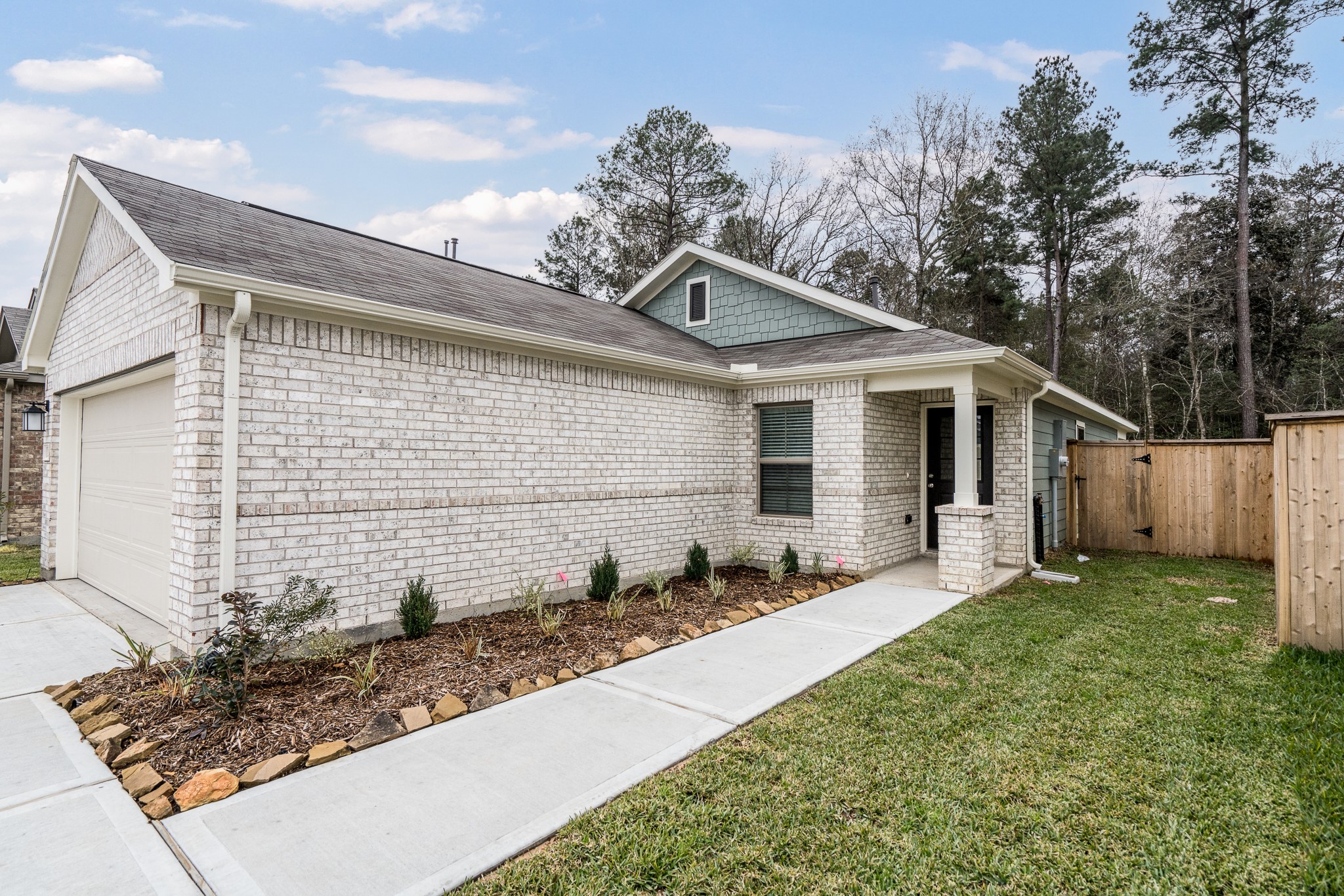 17536 Rosewood Manor Lane New Caney, TX 77357 - Photo 2 of 27 a front view of a house with a yard