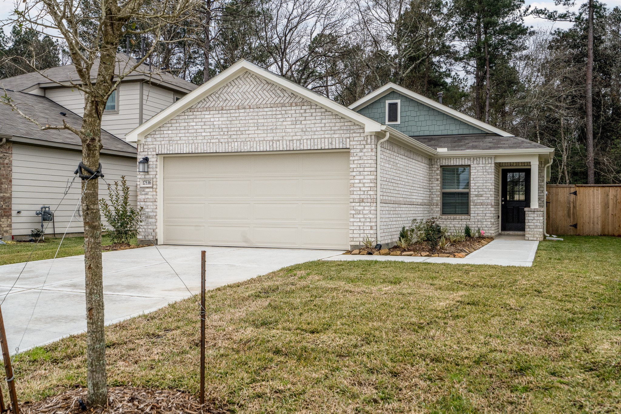 17536 Rosewood Manor Lane New Caney, TX 77357 - Photo 21 of 27 a front view of house with yard