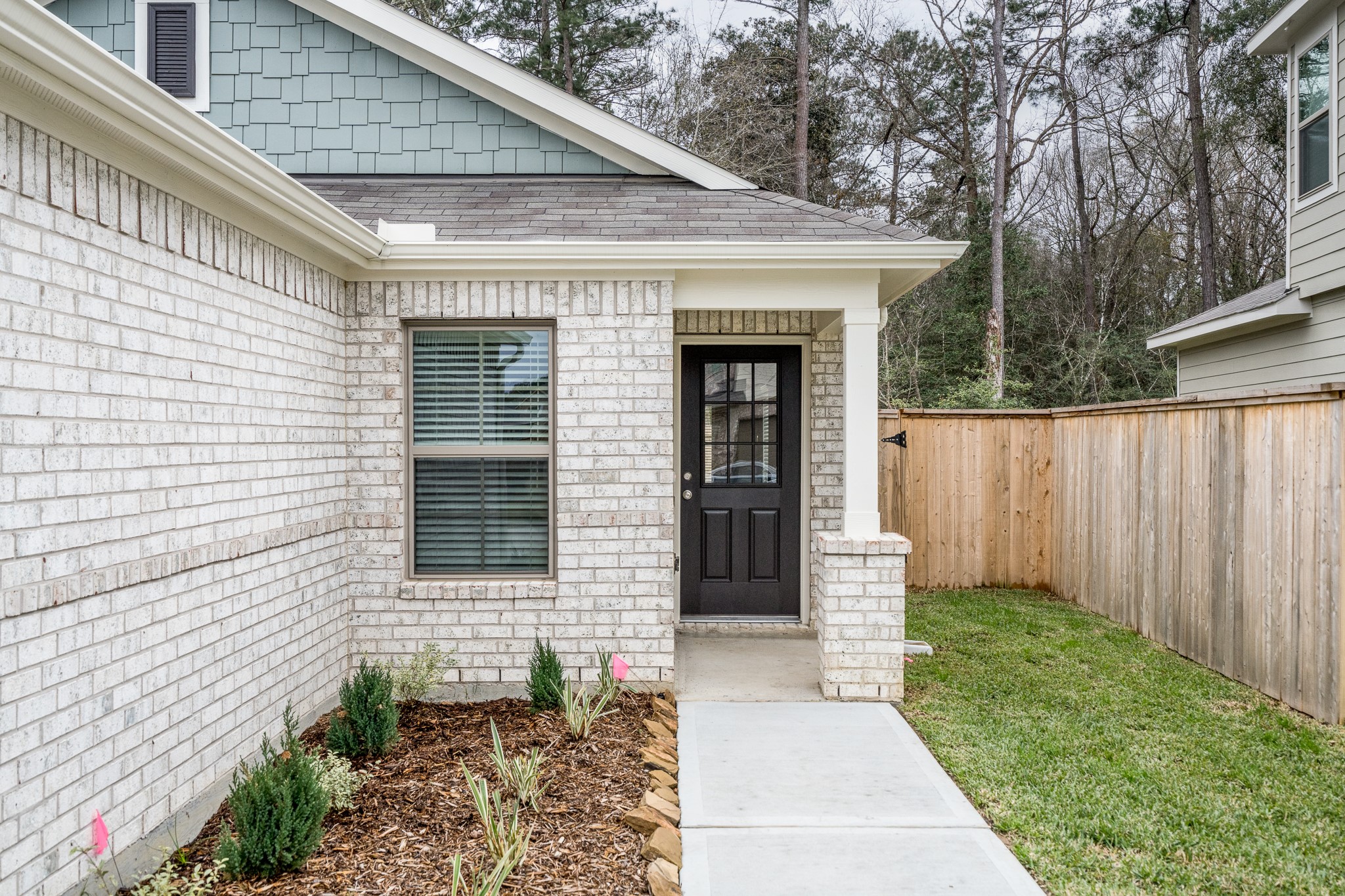 17536 Rosewood Manor Lane New Caney, TX 77357 - Photo 4 of 27 a front view of a house with garden