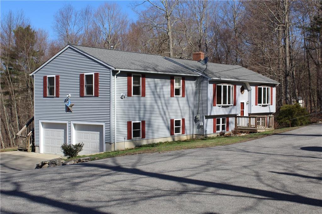 121 Breakneck Hill Road Killingly, CT 06241 - Photo 1 of 1 a view of a white house with large windows next to a road