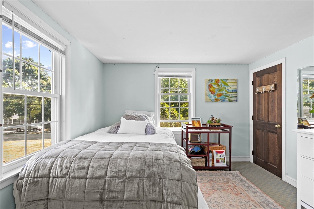 107 Tilden Road Scituate, MA 02066 - Photo 19 of 38 a bedroom with a bed and a large window