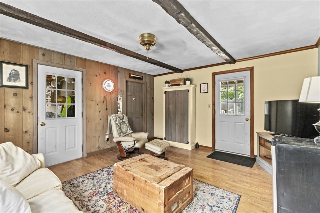 107 Tilden Road Scituate, MA 02066 - Photo 23 of 38 a living room with furniture and a flat screen tv