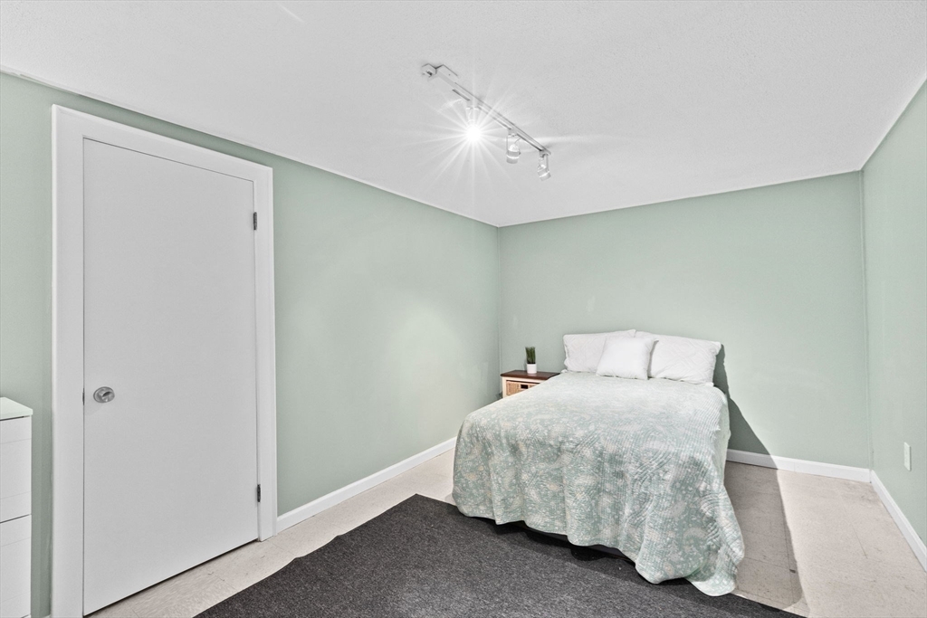 107 Tilden Road Scituate, MA 02066 - Photo 27 of 38 a bedroom with a bed and a window