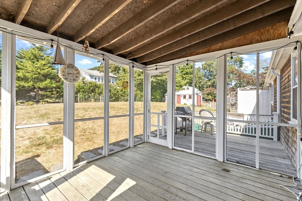 107 Tilden Road Scituate, MA 02066 - Photo 30 of 38 a view of hallway with wooden floor and furniture