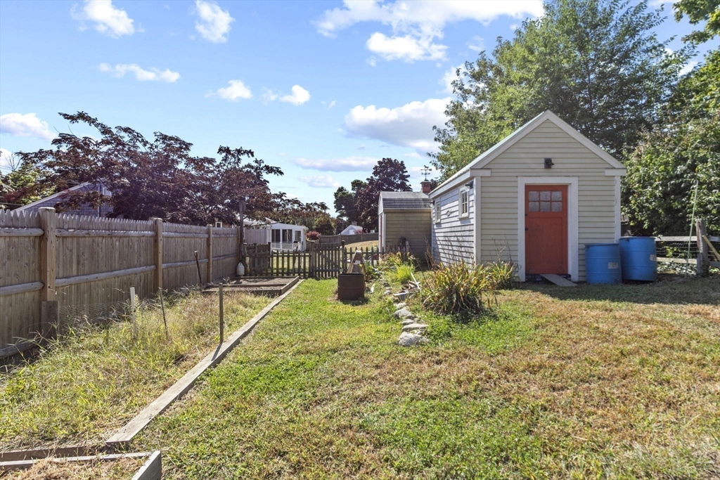 107 Tilden Road Scituate, MA 02066 - Photo 33 of 38 a front view of a house with garden