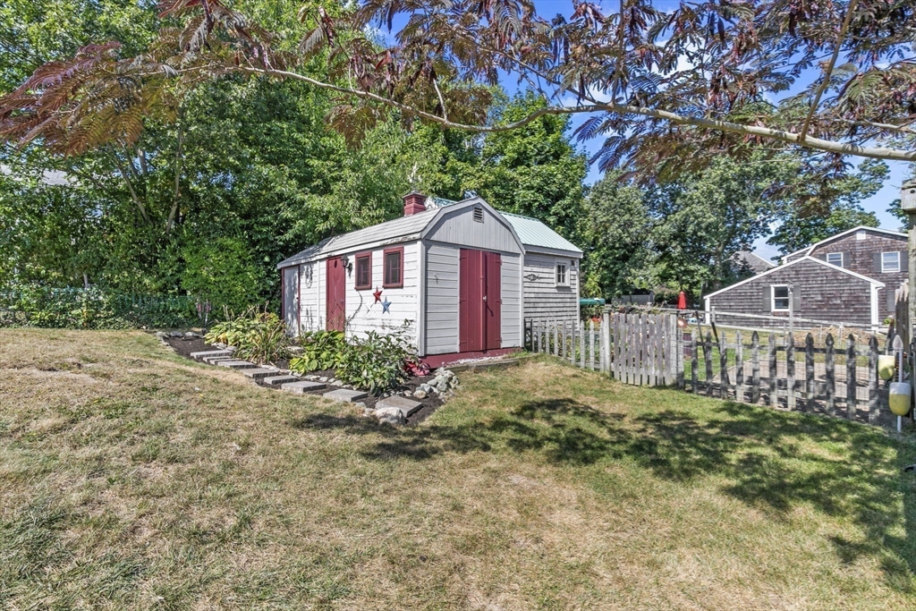107 Tilden Road Scituate, MA 02066 - Photo 34 of 38 a house that has a tree in front of it