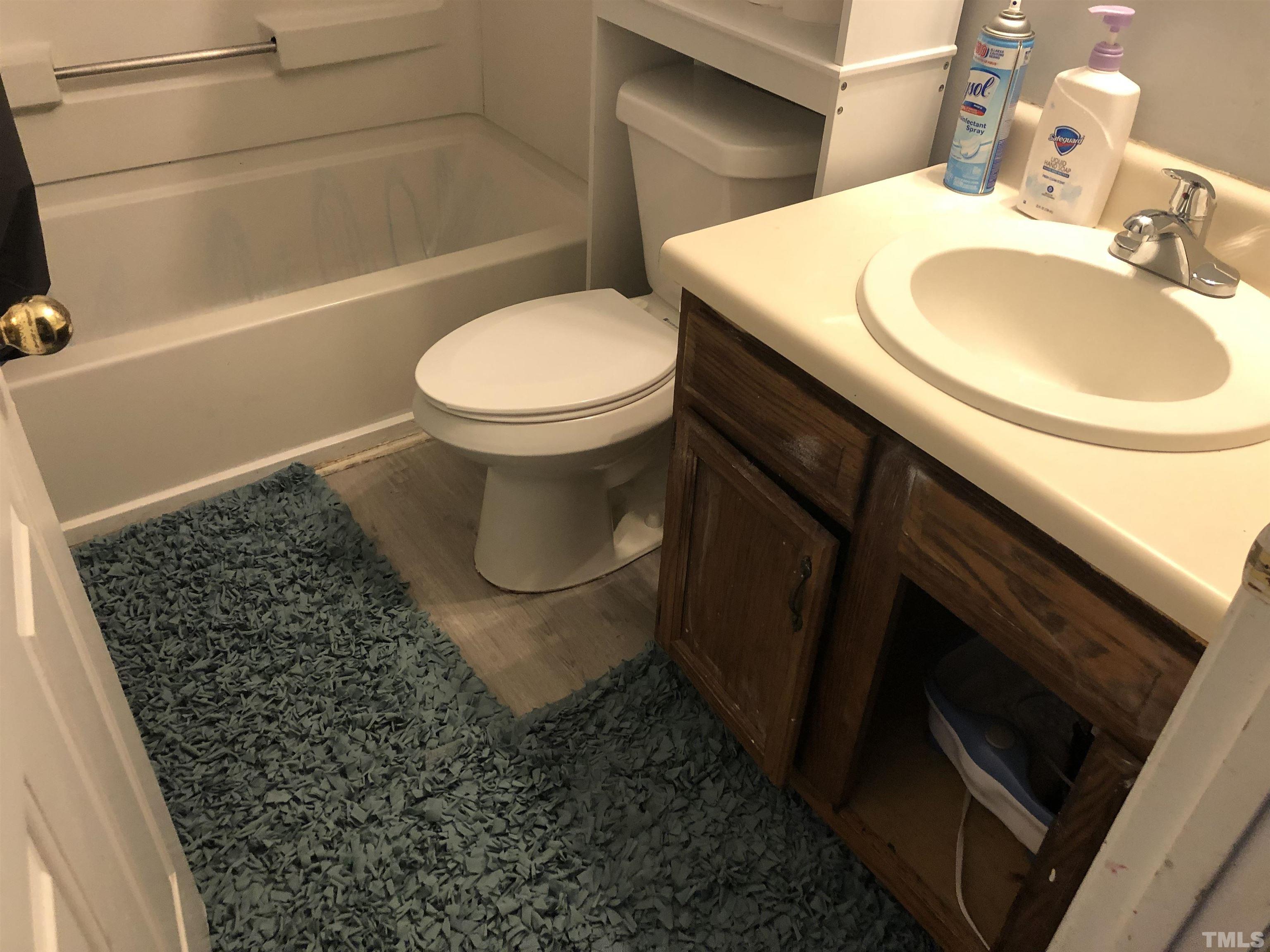 8208 Wynewood Court Raleigh, NC 27616 - Photo 6 of 10 a bathroom with a sink toilet and shower
