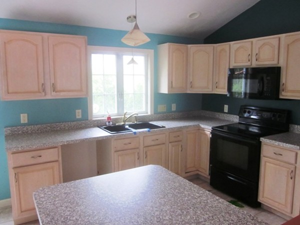 42 Third Street Worcester, MA 01602 - Photo 11 of 26 a kitchen with granite countertop a sink stainless steel appliances and cabinets