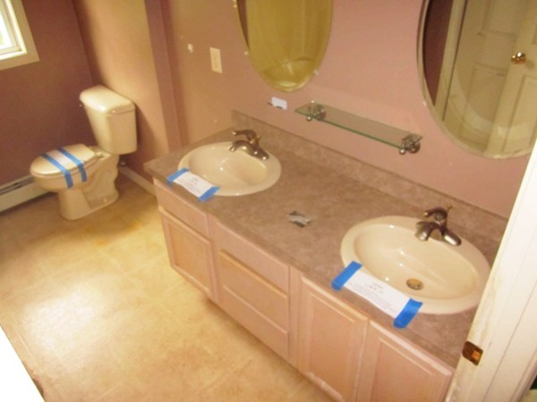 42 Third Street Worcester, MA 01602 - Photo 12 of 26 a bathroom with a sink double vanity and a mirror