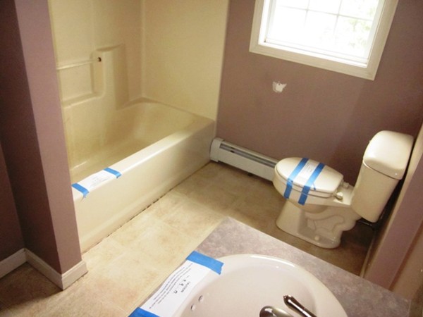 42 Third Street Worcester, MA 01602 - Photo 13 of 26 a bathroom with a tub and sink