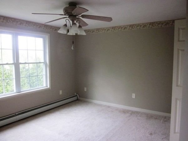 42 Third Street Worcester, MA 01602 - Photo 14 of 26 an empty room with a window and a fan