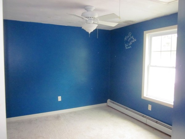 42 Third Street Worcester, MA 01602 - Photo 15 of 26 an empty room with windows and fan