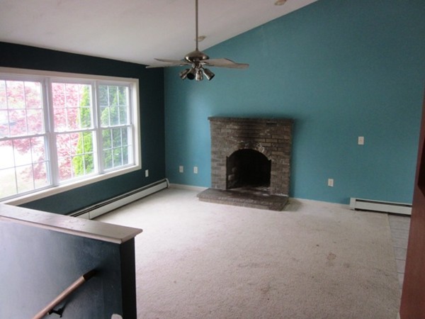 42 Third Street Worcester, MA 01602 - Photo 3 of 26 a view of an empty room with a fireplace and a window