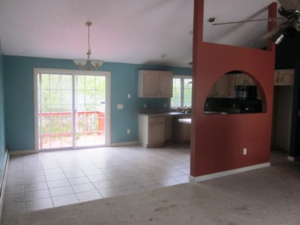 42 Third Street Worcester, MA 01602 - Photo 5 of 26 a view of a kitchen with a stove cabinets and a kitchen counter top space