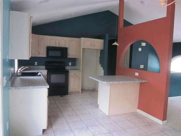 42 Third Street Worcester, MA 01602 - Photo 8 of 26 a kitchen with a stove and a microwave